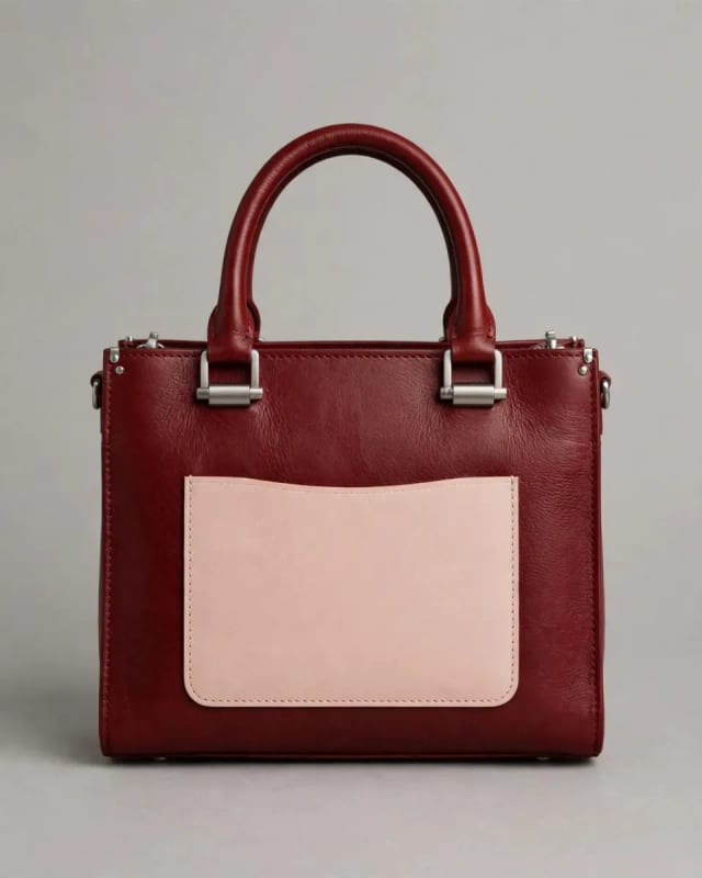 Meta AI illustration: Oxblood and blush handbag